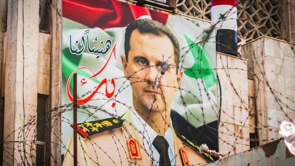 banner-with-bashar-assad-ajker-patrika